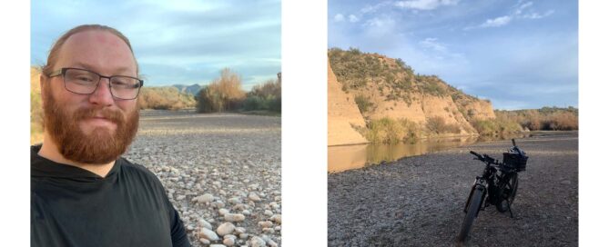 Kevan stands on the river stones with his ebike in the sand next to the Salt River